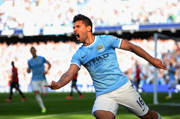 MANCHESTER, ENGLAND - SEPTEMBER 22:  Sergio Aguero of Manchester City (16) celebrates as he scores their first goal during the Barclays Premier League match between Manchester City and Manchester United at the Etihad Stadium on September 22, 2013 in Manchester, England.  (Photo by Laurence Griffiths/Getty Images)