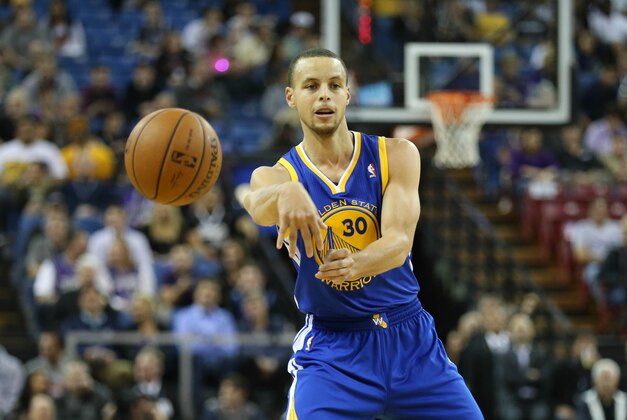 Feb 19, 2014; Sacramento, CA, USA; Golden State Warriors point guard Stephen Curry (30) passes against the Sacramento Kings during the first quarter at Sleep Train Arena. Mandatory Credit: Kelley L Cox-USA TODAY Sports