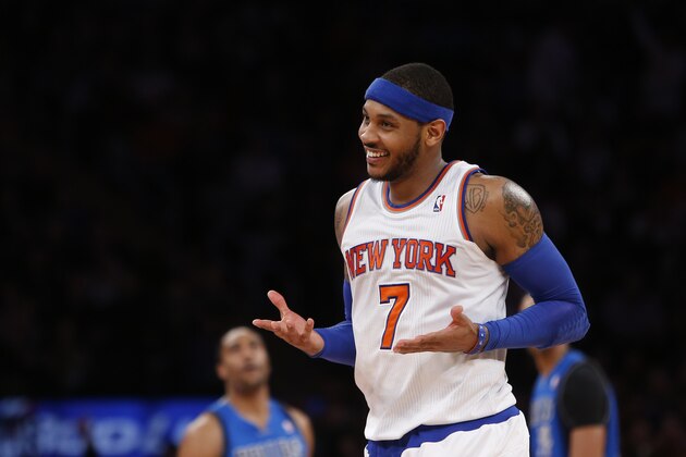 New York Knicks' Carmelo Anthony (7) reacts after hitting a 3-point shot against the Dallas Mavericks during the second half of an NBA basketball game Monday, Feb. 24, 2014, in New York.  Dallas won 110-108. (AP Photo/Jason DeCrow)