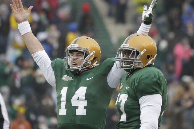 Baylor quarterback Bryce Petty (14)  celebrates a play as teammate Kelvin Palmer (77) stands by during the first half of an NCAA college football game against Texas Saturday, Dec. 7, 2013, in Waco, Texas.  (AP Photo/LM Otero)