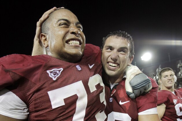 Stanford quarterback Andrew Luck, right, and Jonathan Martin (73) celebrate after Stanford upset Washington 34-13  an NCAA football game in Stanford, Calif., Saturday, Sept. 26, 2009. (AP Photo/Paul Sakuma)