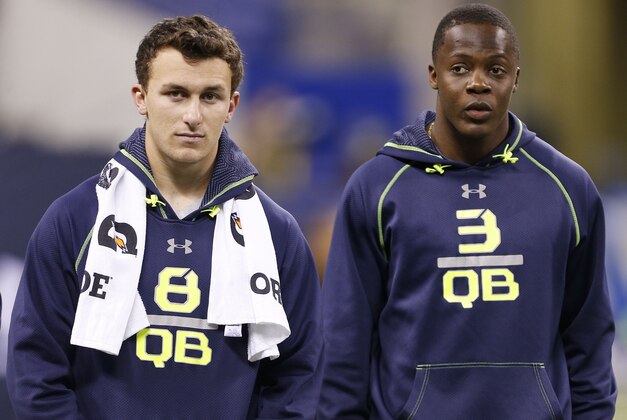 Feb 23, 2014; Indianapolis, IN, USA; Texas A&M quarterback Johnny Manziel (L) and Louisville Cardinals quarterback Teddy Bridgewater (R) look on during the 2014 NFL Combine at Lucas Oil Stadium. Mandatory Credit: Brian Spurlock-USA TODAY Sports