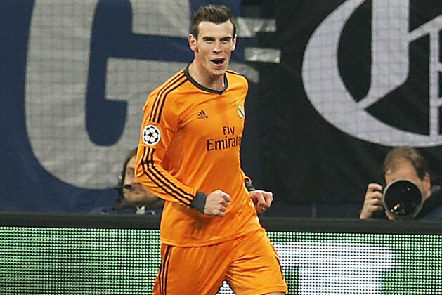 Real's Gareth Bale celebrates his side's fifth goal during the Champions League round of the last 16 first leg soccer match between Schalke 04 and Real Madrid in Gelsenkirchen, Germany, Wednesday, Feb.26,2014. (AP Photo/Frank Augstein)