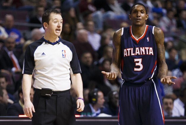 Feb 21, 2014; Auburn Hills, MI, USA; Atlanta Hawks shooting guard Louis Williams (3) talks to referee Scott Twardoski after being called for a foul in the fourth quarter against the Detroit Pistons at The Palace of Auburn Hills. Mandatory Credit: Rick Osentoski-USA TODAY Sports