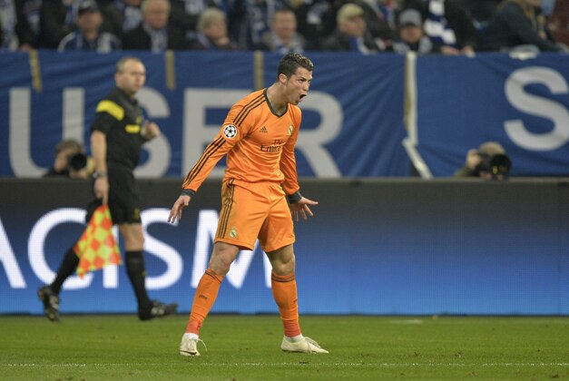 Real's Cristiano Ronaldo celebrates after he scored during a Champions League round of sixteen, first leg soccer match between Schalke 04 and Real Madrid at the Veltins Arena in Gelsenkirchen, Germany, Wednesday Feb. 26, 2014. (AP Photo/Martin Meissner)