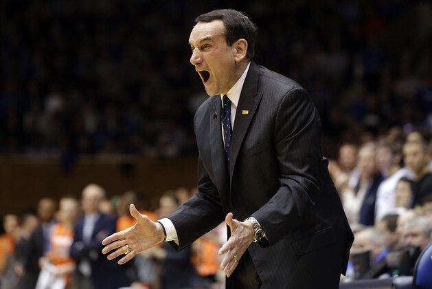 Duke coach Mike Krzyzewski reacts during the first half of an NCAA college basketball game against Syracuse in Durham, N.C., Saturday, Feb. 22, 2014. (AP Photo/Gerry Broome)