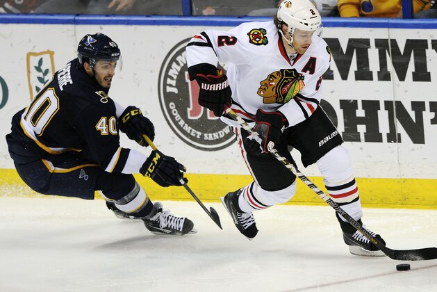 St. Louis Blues' Maxim Papierre (40) chases Chicago Blackhawks' Duncan Keith (2) during the second period of an NHL hockey game Saturday, Dec. 28, 2013, in St. Louis. (AP Photo/Bill Boyce)