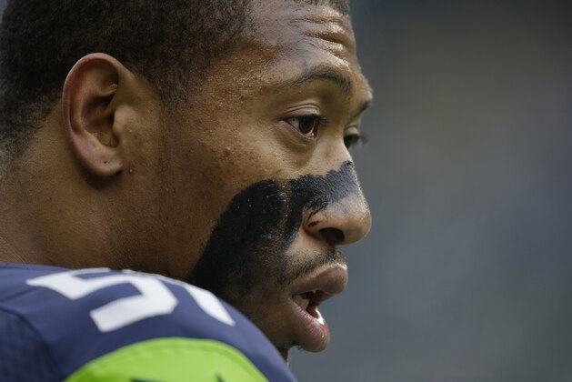 Seattle Seahawks' Bruce Irvin stands on the sidelines before an NFL football game against the St. Louis Rams, Sunday, Dec. 29, 2013, in Seattle. (AP Photo/Elaine Thompson)
