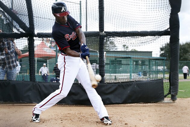 Atlanta Braves center fielder B.J. Upton hits a pitch during a spring training baseball workout, Monday, Feb. 24, 2014, in Kissimmee, Fla. (AP Photo/Alex Brandon)