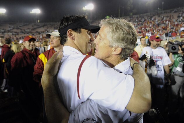 Southern California head coach Pete Carroll, left, embraces offensive coordinator Steve Sarkisian after their team beat Penn State 38-24 at the Rose Bowl NCAA college football game in Pasadena, Calif., Thursday, Jan. 1, 2009.  (AP Photo/Chris Carlson)