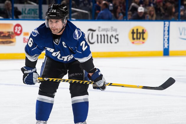 TAMPA, FL - JANUARY 25: Martin St. Louis #26 of the Tampa Bay Lightning skates against the Colorado Avalanche at the Tampa Bay Times Forum on January 25, 2014 in Tampa, Florida.  (Photo by Scott Audette/NHLI via Getty Images)