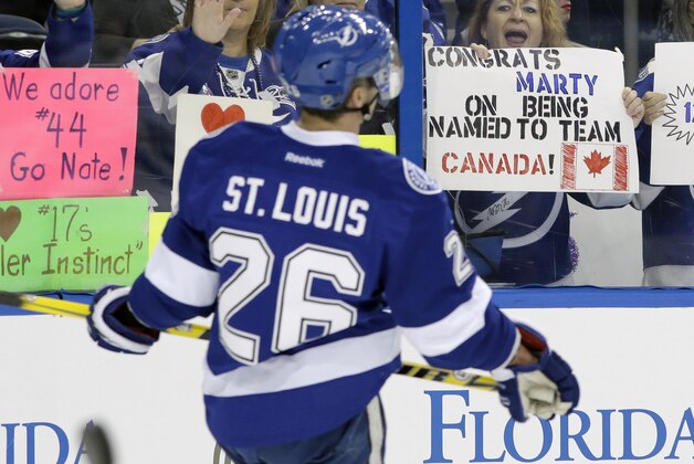 A fan holds up a sign congratulatingTampa Bay Lightning right winger Martin St. Louis (26) for being selected to the Canadian Olympic hockey team before an NHL hockey game against the Toronto Maple Leafs Thursday, Feb. 6, 2014, in Tampa, Fla. St. Louis replaces teammate Steven Stamkos, who is still recovering from a broken leg. (AP Photo/Chris O'Meara)