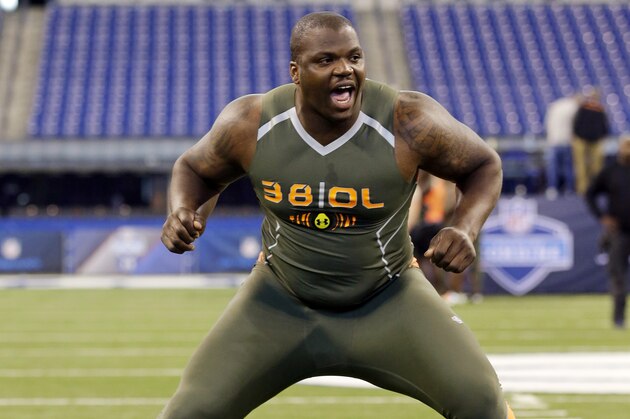 Auburn offensive lineman Greg Robinson runs a drill at the NFL football scouting combine in Indianapolis, Saturday, Feb. 22, 2014. (AP Photo/Michael Conroy)