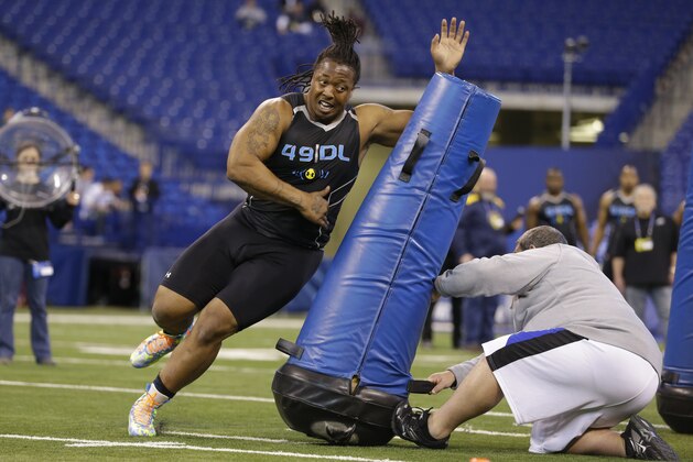 Southern Mississippi defensive lineman Khyri Thornton runs a drill at the NFL football scouting combine in Indianapolis, Monday, Feb. 24, 2014. (AP Photo/Michael Conroy)