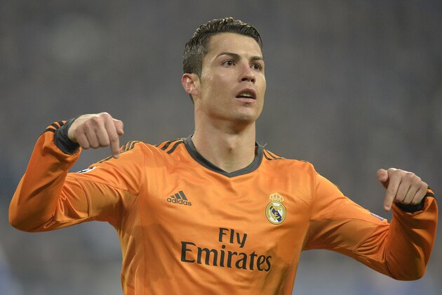 Real's Cristiano Ronaldo reacts after scoring during a Champions League round of sixteen, first leg soccer match between Schalke 04 and Real Madrid at the Veltins Arena in Gelsenkirchen, Germany, Wednesday Feb. 26, 2014. (AP Photo/Martin Meissner)