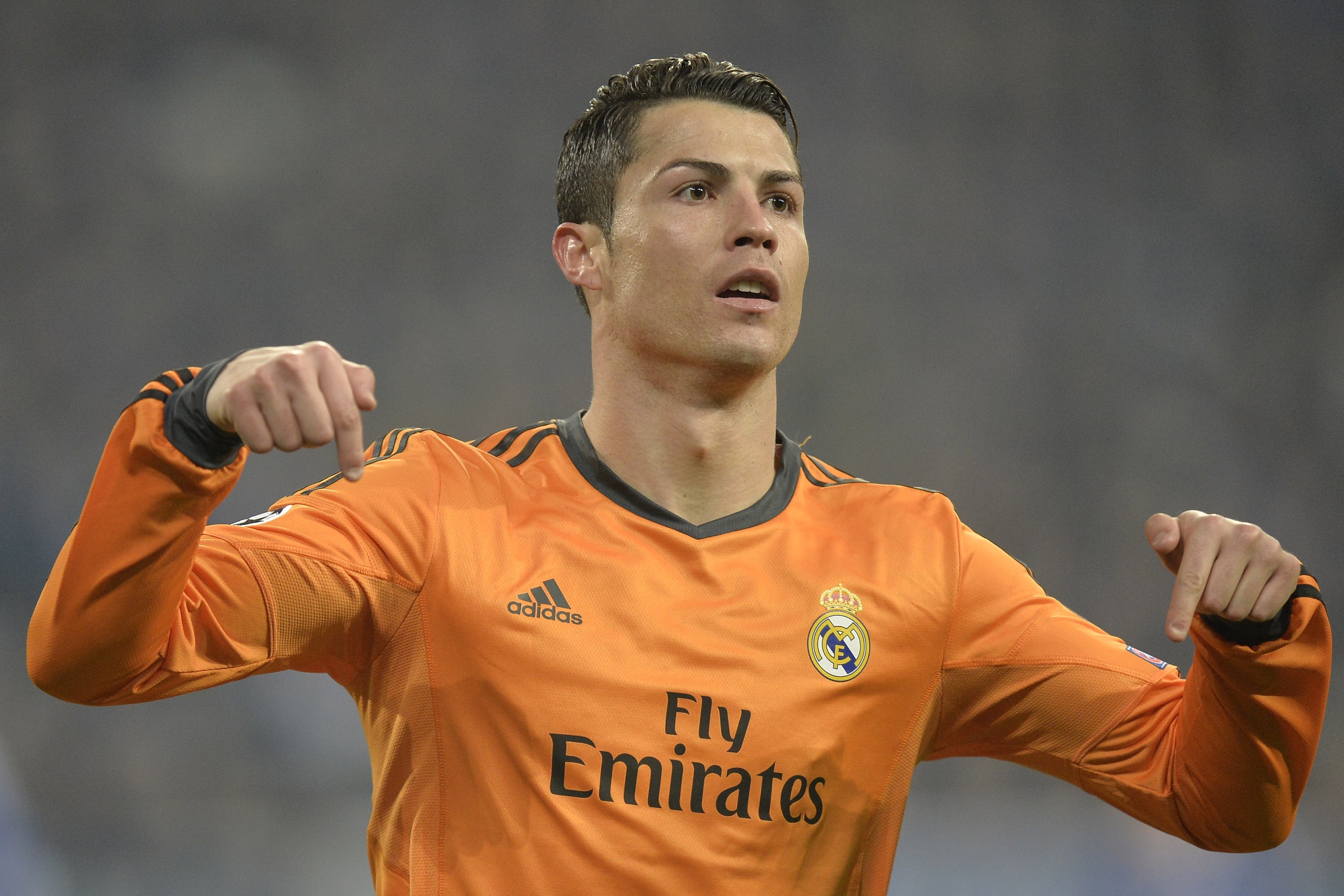 Real's Cristiano Ronaldo reacts after scoring during a Champions League round of sixteen, first leg soccer match between Schalke 04 and Real Madrid at the Veltins Arena in Gelsenkirchen, Germany, Wednesday Feb. 26, 2014. (AP Photo/Martin Meissner)