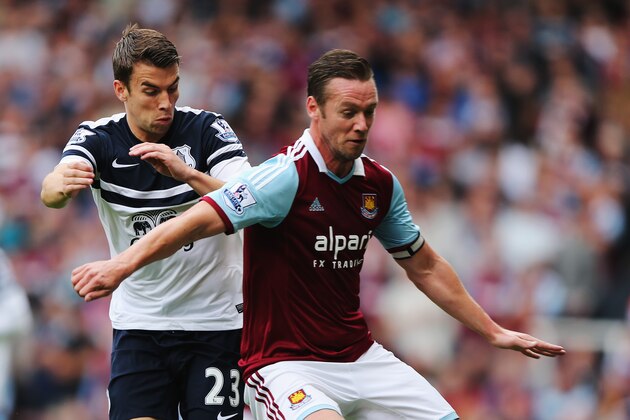 LONDON, ENGLAND - SEPTEMBER 21:  Kevin Nolan (R) of West Ham United holds off the challenge of Seamus Coleman (L) of Everton during the Barclays Premier League match between West Ham United and Everton at the Boleyn Ground on September 21, 2013 in London, England.  (Photo by Ian Walton/Getty Images)