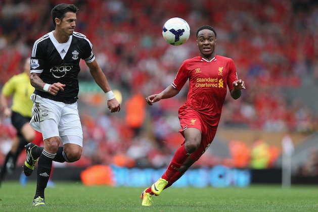 LIVERPOOL, ENGLAND - SEPTEMBER 21:  Raheem Sterling of Liverpool in action with Jose Fonte of Southampton during the Barclays Premier League match between Liverpool and Southampton at Anfield on September 21, 2013 in Liverpool, England.  (Photo by Clive Brunskill/Getty Images)