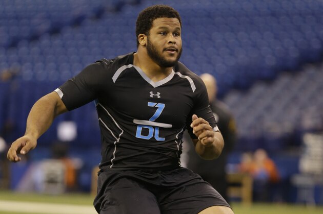 Pittsburgh defensive lineman Aaron Donald runs a drill at the NFL football scouting combine in Indianapolis, Monday, Feb. 24, 2014. (AP Photo/Michael Conroy)