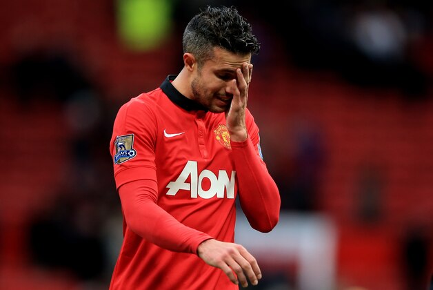 MANCHESTER, ENGLAND - DECEMBER 07:  A dejected Robin van Persie of Manchester United walks off the pitch following his team's 1-0 defeat during the Barclays Premier League match between Manchester United and Newcastle United at Old Trafford on December 7, 2013 in Manchester, England.  (Photo by Richard Heathcote/Getty Images)