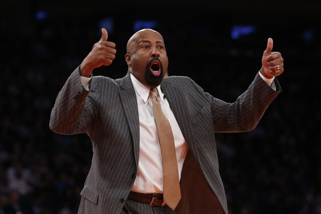 New York Knicks coach Mike Woodson argues a call during the second half of an NBA basketball game against the Dallas Mavericks Monday, Feb. 24, 2014, in New York.  Dallas won 110-108. (AP Photo/Jason DeCrow)