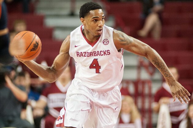Dec 19, 2013; Fayetteville, AR, USA; Arkansas Razorbacks forward Coty Clarke (4) dribbles during a game against the UT Martin Skyhawks at Bud Walton Arena. Arkansas defeated UT Martin 102-56. Mandatory Credit: Beth Hall-USA TODAY Sports