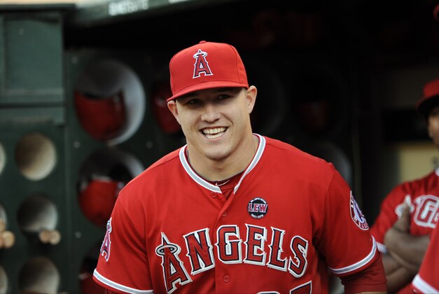 Sep 17, 2013; Oakland, CA, USA; Los Angeles Angels center fielder Mike Trout (27) prepares for the game in the dugout before the game against the Oakland Athletics at O.co Coliseum. Mandatory Credit: Bob Stanton-USA TODAY Sports
