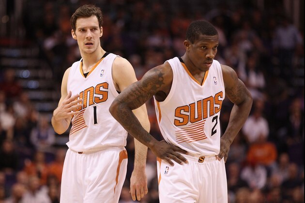 PHOENIX, AZ - DECEMBER 18:  Goran Dragic #1 and Eric Bledsoe #2 of the Phoenix Suns await a free throw shot during the NBA game against the San Antonio Spurs at US Airways Center on December 18, 2013 in Phoenix, Arizona. The Spurs defeated the 108-101.  NOTE TO USER: User expressly acknowledges and agrees that, by downloading and or using this photograph, User is consenting to the terms and conditions of the Getty Images License Agreement.  (Photo by Christian Petersen/Getty Images)