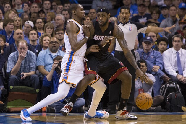 Oklahoma City, OK - February 20: LeBron James #6 of the Miami Heat drives to the basket against Kevin Durant #35 of the Oklahoma City Thunder at the Chesapeake Arena on February 20, 2014 in Oklahoma City, OK. NOTE TO USER:  User expressly acknowledges and agrees that, by downloading and/or using this photograph, user is consenting to the terms and conditions of the Getty Images License Agreement. Mandatory Copyright Notice:  Copyright 2014 NBAE (Photo by Richard Rowe/NBAE via Getty Images)