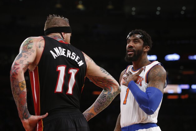 New York Knicks' Amar'e Stoudemire (1) talks to Miami Heat's Chris Andersen (11) during the first half of an NBA basketball game Saturday, Feb. 1, 2014, in New York.  Miami won 106-91.  (AP Photo/Jason DeCrow)