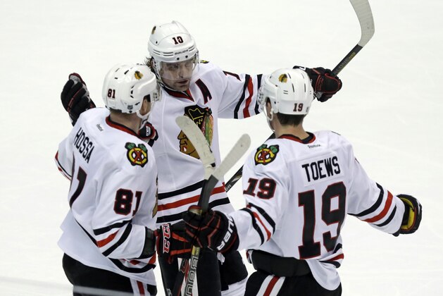 Chicago Blackhawks left winger Patrick Sharp (10) and right winger Marian Hossa (81), of the Czech Republic, celebrate a goal by center Jonathan Toews (19) against the Anaheim Ducks in the third period of an NHL hockey game in Anaheim, Calif., Wednesday, Feb. 5, 2014. The Blackhawks won, 2-0. (AP Photo/Reed Saxon) Chicago Blackhawks left winger Patrick Sharp (10) and right winger Marian Hossa (81), of the Czech Republic, celebrate a goal by center Jonathan Toews (19) against the Anaheim Ducks in the third period of an NHL hockey game in Anaheim, Calif., Wednesday, Feb. 5, 2014. The Blackhawks won, 2-0. (AP Photo/Reed Saxon)