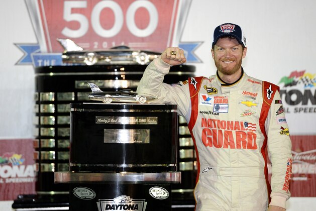 DAYTONA BEACH, FL - FEBRUARY 23:  Dale Earnhardt Jr., driver of the #88 National Guard Chevrolet, celebrates in Victory Lane with the the Harley J. Earl trophy after winning the NASCAR Sprint Cup Series Daytona 500 at Daytona International Speedway on February 23, 2014 in Daytona Beach, Florida.  (Photo by Patrick Smith/Getty Images)