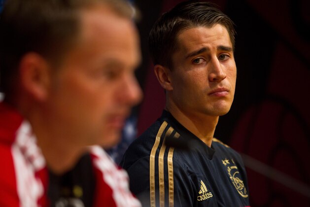 Ajax Amsterdam's coach Frank De Boer left and Ajax Amsderdan‘s player Bojan Krkic from Spain attends a press conference at the Camp Nou stadium, before a training session prior to the Champions League first round group F soccer match between FC Barcelona and Ajax Amsterdam, in Barcelona, Spain, Tuesday, Sept. 17, 2013. Barcelona will face Ajax Wednesday. (AP Photo/Joan Manuel Baliellas)