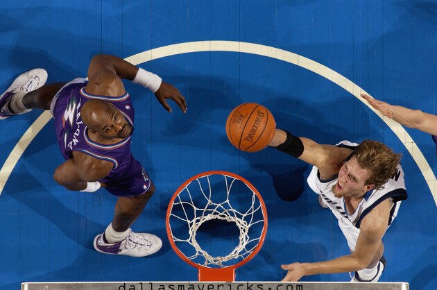 DALLAS - DECEMBER 20: Dirk Nowitzki #41 of the Dallas Mavericks goes up for the layup against Karl Malone #32 of the Utah Jazz during the NBA game at American Airlines Center on December 20, 2002 in Dallas, Texas. The Jazz won 93-81. NOTE TO USER: User expressly acknowledges and agrees that, by downloading and or using this Photograph, User is consenting to the terms and conditions of the Getty Images License Agreement. Mandatory copyright notice: Copyright 2002 NBAE. (Photo by: Glenn James/NBAE/Getty Images) DALLAS - DECEMBER 20: Dirk Nowitzki #41 of the Dallas Mavericks goes up for the layup against Karl Malone #32 of the Utah Jazz during the NBA game at American Airlines Center on December 20, 2002 in Dallas, Texas. The Jazz won 93-81. NOTE TO USER: User expressly acknowledges and agrees that, by downloading and or using this Photograph, User is consenting to the terms and conditions of the Getty Images License Agreement. Mandatory copyright notice: Copyright 2002 NBAE. (Photo by: Glenn James/NBAE/Getty Images)