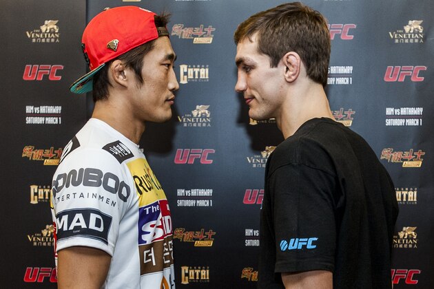 MACAU - FEBRUARY 26:  DH Kim (L) of South Korea and John Hathaway of England pose for media during the presentation of UFC Fight Night Macao Kim vs. Hathaway on February 26, 2014 in Macau  (Photo by Xaume Olleros/Getty Images)