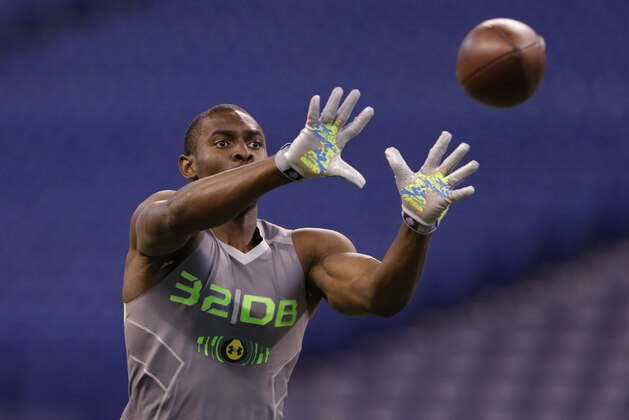 Nebraska defensive back Stanley Jean-Baptiste runs a drill at the NFL football scouting combine in Indianapolis, Tuesday, Feb. 25, 2014. (AP Photo/Michael Conroy)