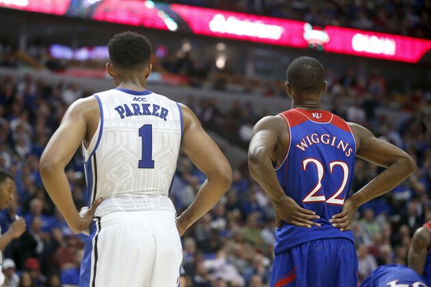 Duke forward Jabari Parker (1) and Kansas guard Andrew Wiggins (22) wait for a free throw during the second half of an NCAA college basketball game Tuesday, Nov. 12, 2013, in Chicago. Kansas won 94-83. (AP Photo/Charles Rex Arbogast)