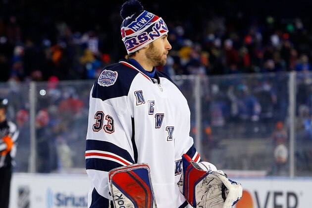 NEW YORK, NY - JANUARY 29:  (EDITORIAL USE ONLY)  Cam Talbot #33 of the New York Rangers looks on against the New York Islanders during the 2014 Coors Light NHL Stadium Series at Yankee Stadium on January 29, 2014 in the Bronx borough of New York City. The Rangers defeated the Islanders 2-1.  (Photo by Jim McIsaac/NHLI via Getty Images)