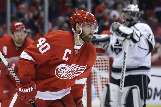 Detroit Red Wings left wing Henrik Zetterberg (40), of Sweden, skates in front of Los Angeles Kings goalie Jonathan Quick (32) after scoring a goal during the second period of an NHL hockey game in Detroit, Saturday, Jan. 18, 2014. (AP Photo/Carlos Osorio)