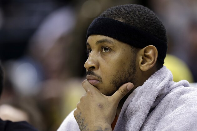 New York Knicks forward Carmelo Anthony on the bench during the second half of an NBA basketball game against the Indiana Pacers in Indianapolis, Thursday, Jan. 16, 2014. The Pacers defeated the Knicks 117-89. (AP Photo/Michael Conroy)