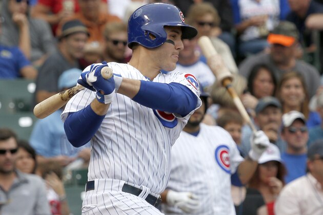 Chicago Cubs' Anthony Rizzo hits an RBI single off Atlanta Braves starting pitcher Paul Maholm, scoring Starlin Castro, during the third inning of a baseball game Friday, Sept. 20, 2013, in Chicago. (AP Photo/Charles Rex Arbogast)