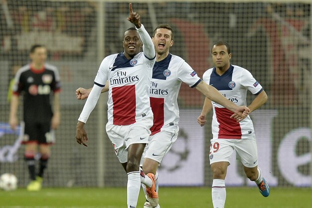 PSG's Blaise Matuidi, left, celebrates his side's opening goal during a Champions League round of the last 16 first leg soccer match between Bayer Leverkusen and Paris Saint-Germain in Leverkusen, Germany, Tuesday Feb. 18, 2014.  (AP Photo/Martin Meissner)