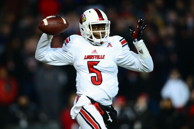 Dec 5, 2013; Cincinnati, OH, USA; Louisville Cardinals quarterback Teddy Bridgewater (5) throws a pass during the first quarter against the Cincinnati Bearcats at Nippert Stadium. Mandatory Credit: Andrew Weber-USA TODAY Sports