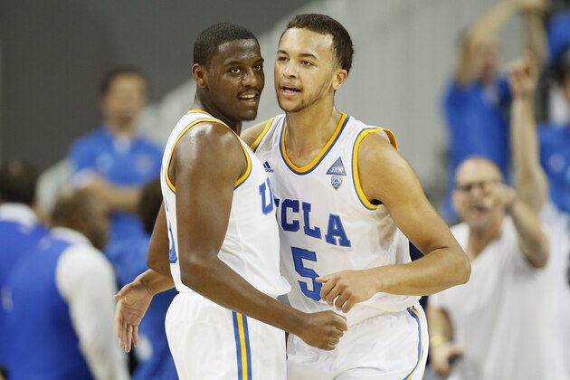 UCLA's Jordan Adams, left, and Kyle Anderson, right, celebrate after the first half against Southern California during an NCAA college basketball game on Sunday, Jan. 5, 2014, in Los Angeles. (AP Photo/Danny Moloshok)