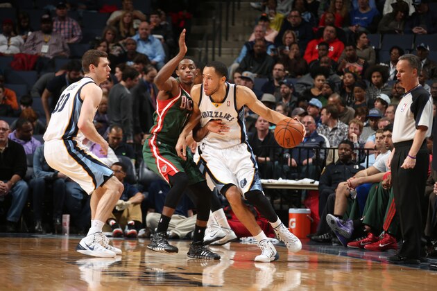 MEMPHIS, TN - FEBRUARY 1: Tayshaun Prince #21 of the Memphis Grizzlies controls the ball against Brandon Knight #11 of the Milwaukee Bucks on February 1, 2014 at FedExForum in Memphis, Tennessee. NOTE TO USER: User expressly acknowledges and agrees that, by downloading and or using this photograph, User is consenting to the terms and conditions of the Getty Images License Agreement. Mandatory Copyright Notice: Copyright 2014 NBAE (Photo by Joe Murphy/NBAE via Getty Images)