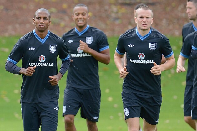ST ALBANS, ENGLAND - AUGUST 13: Ashley Young, Tom Cleverley and Jack Rodwell of England warm up with their team-mates during England Training session at London Colney on August 13, 2012 in St Albans, England. (Photo by Tom Dulat/Getty Images)