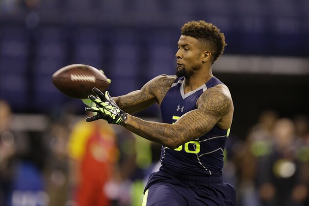 Louisiana State wide receiver Odell Beckham makes a catch during a drill at the NFL football scouting combine in Indianapolis, Sunday, Feb. 23, 2014. (AP Photo/Michael Conroy)