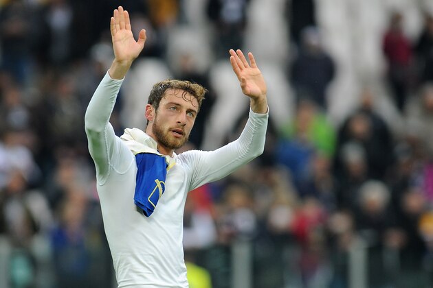 TURIN, ITALY - FEBRUARY 16:  Claudio Marchisio of Juventus salutes at the end of the Serie A match between Juventus and AC Chievo Verona at Juventus Arena on February 16, 2014 in Turin, Italy.  (Photo by Valerio Pennicino/Getty Images)