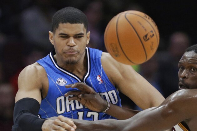 Orlando Magic's Tobias Harris, left, and Cleveland Cavaliers' Luol Deng watch the ball during the first quarter of an NBA basketball game Wednesday, Feb. 19, 2014, in Cleveland. (AP Photo/Tony Dejak)