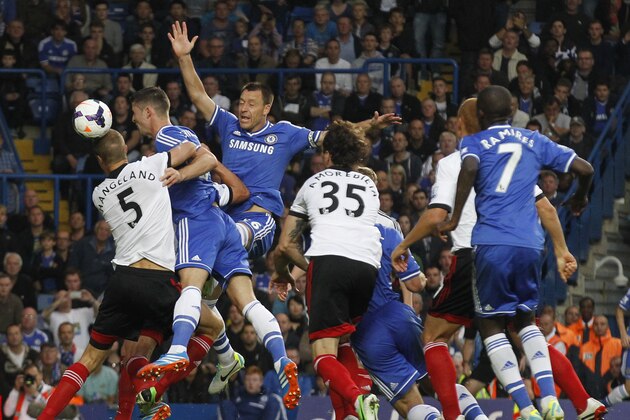 Fulham's Brede Hangeland, left heads the ball as Chelsea's Gary Cahill, second left and teammate Chelsea's John Terry, third left, try to reach the ball during the English Premier League soccer match between Chelsea and Fulham at Stamford Bridge, London, Saturday, Sept. 21, 2013. (AP Photo/Sang Tan) Fulham's Brede Hangeland, left heads the ball as Chelsea's Gary Cahill, second left and teammate Chelsea's John Terry, third left, try to reach the ball during the English Premier League soccer match between Chelsea and Fulham at Stamford Bridge, London, Saturday, Sept. 21, 2013. (AP Photo/Sang Tan)
